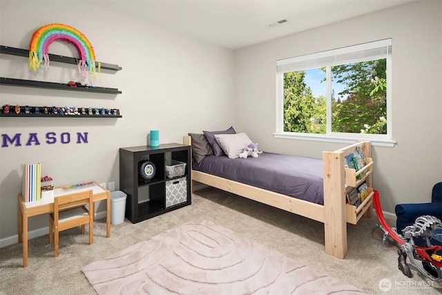 carpeted bedroom featuring baseboards