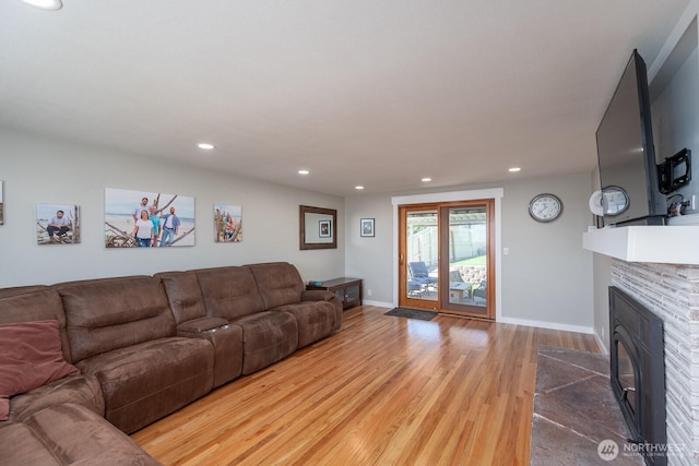 303 Patrick Rd, Ephrata, WA 98823 - living area featuring wood finished floors, a fireplace with flush hearth, recessed lighting, and baseboards