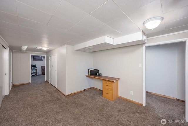 303 Patrick Rd, Ephrata, WA 98823 - finished below grade area with carpet floors, an office area, baseboards, and a drop ceiling