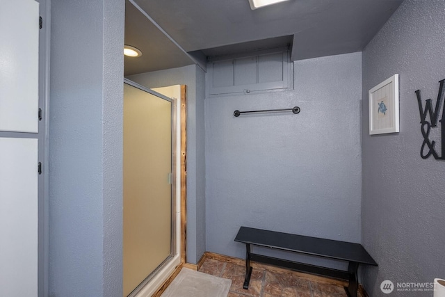 303 Patrick Rd, Ephrata, WA 98823 - bathroom featuring a shower stall and a textured wall