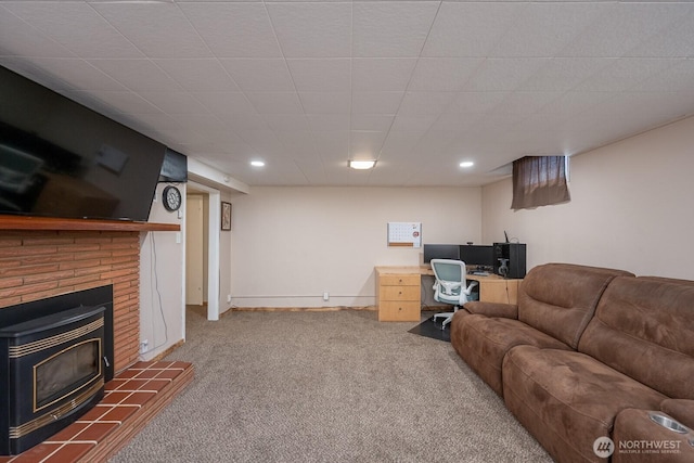 303 Patrick Rd, Ephrata, WA 98823 - carpeted living room with a desk, a wood stove, recessed lighting, and baseboards