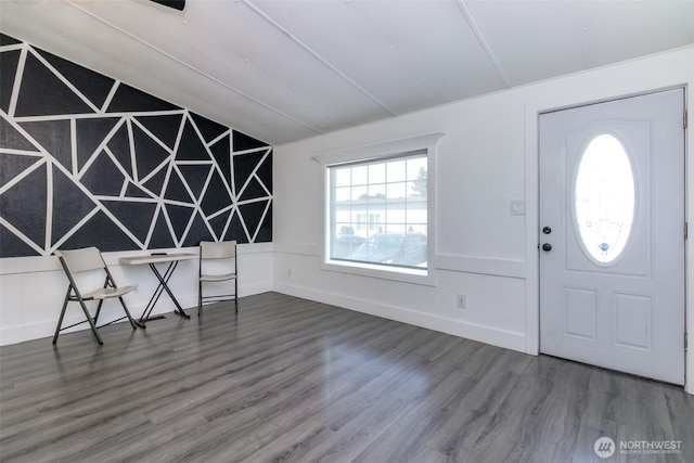 foyer with vaulted ceiling and wood finished floors