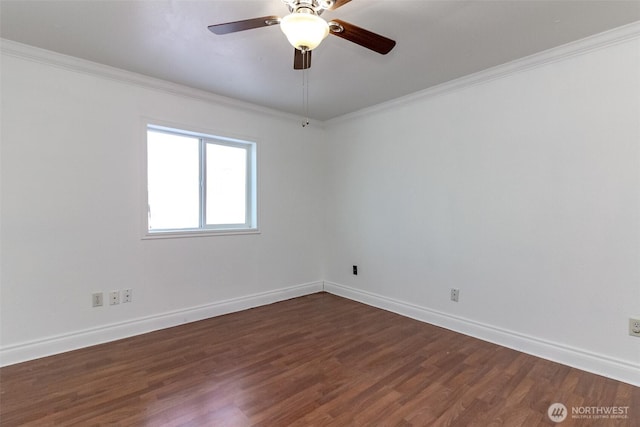 empty room featuring baseboards, ornamental molding, dark wood-style floors, and ceiling fan