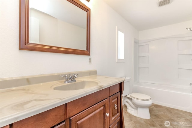bathroom featuring toilet, vanity, shower / washtub combination, and tile patterned flooring