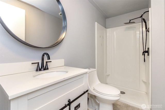 full bathroom featuring a stall shower, vanity, toilet, and tile patterned floors
