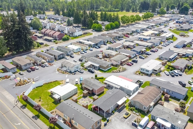 aerial view of residential area with a heavily wooded area