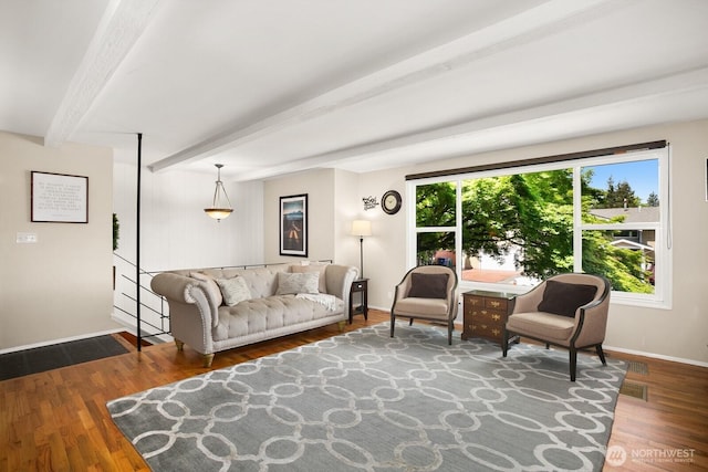 12555 SE 72nd St, Newcastle, WA 98056 - living room featuring beamed ceiling, wood finished floors, and baseboards