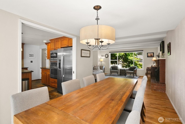 12555 SE 72nd St, Newcastle, WA 98056 - dining room with a chandelier and dark wood-type flooring