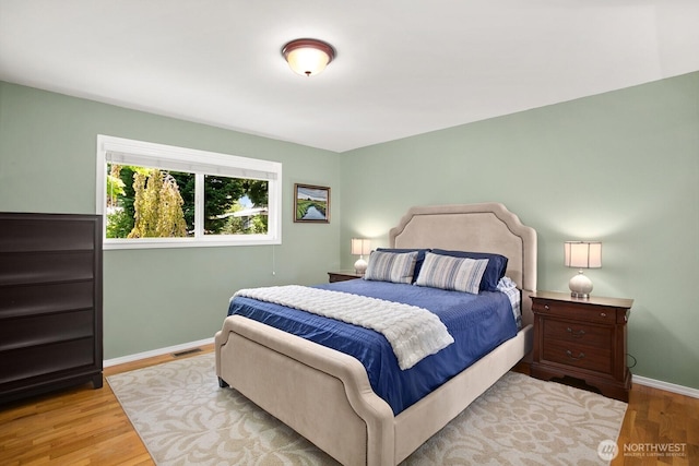 12555 SE 72nd St, Newcastle, WA 98056 - bedroom featuring wood finished floors and baseboards