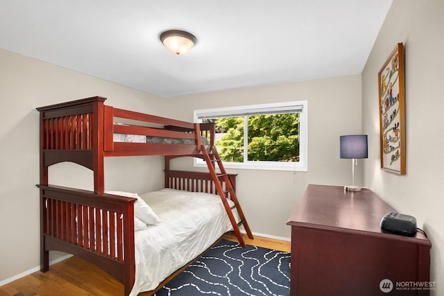 12555 SE 72nd St, Newcastle, WA 98056 - bedroom featuring wood finished floors, baseboards, and an office area