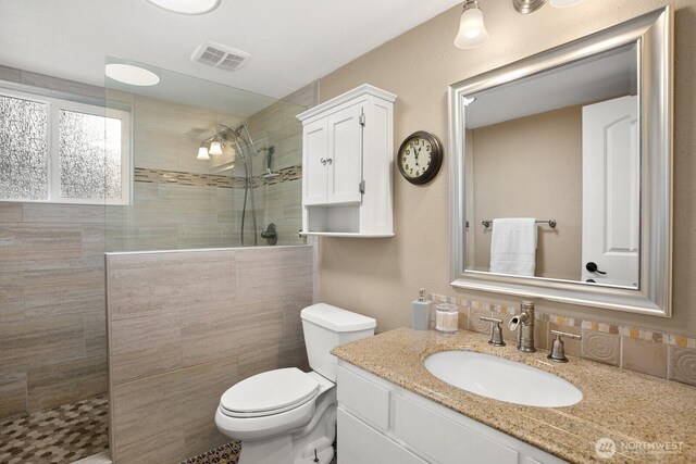 12555 SE 72nd St, Newcastle, WA 98056 - bathroom featuring walk in shower, toilet, and vanity