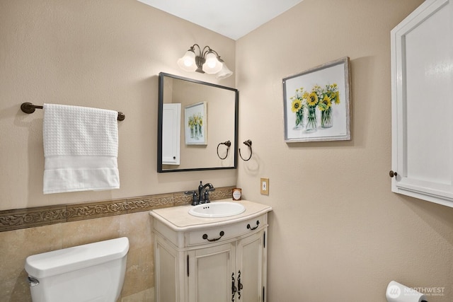 12555 SE 72nd St, Newcastle, WA 98056 - half bathroom with toilet, vanity, and tile walls