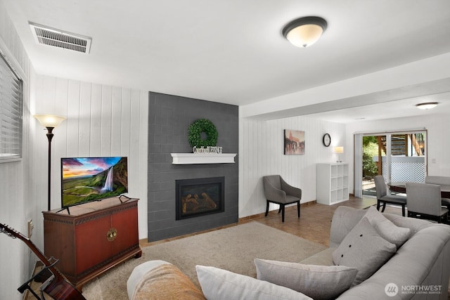 12555 SE 72nd St, Newcastle, WA 98056 - living room featuring a large fireplace and wood walls
