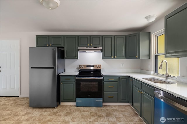 526 E Arcadia Ave, Shelton, WA 98584 - kitchen with appliances with stainless steel finishes, under cabinet range hood, a sink, and light countertops