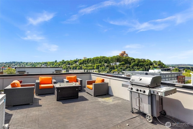 view of patio with area for grilling and outdoor lounge area