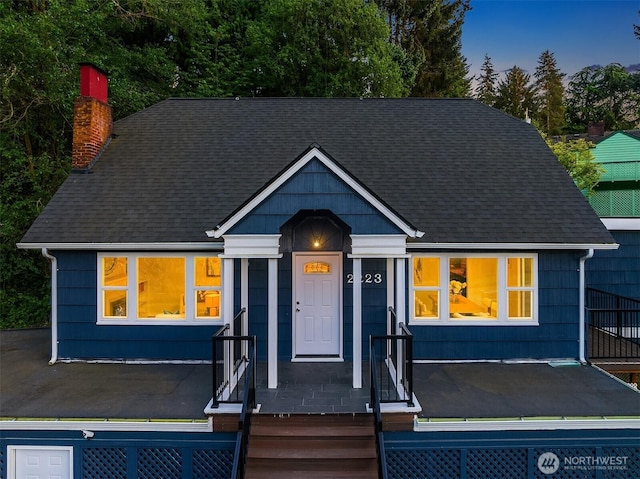 2223 NE 125th St, Seattle, WA 98125 - view of front of home with a chimney and a shingled roof