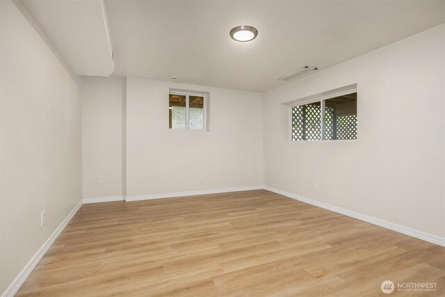 2223 NE 125th St, Seattle, WA 98125 - empty room with light wood-type flooring, baseboards, and healthy amount of natural light