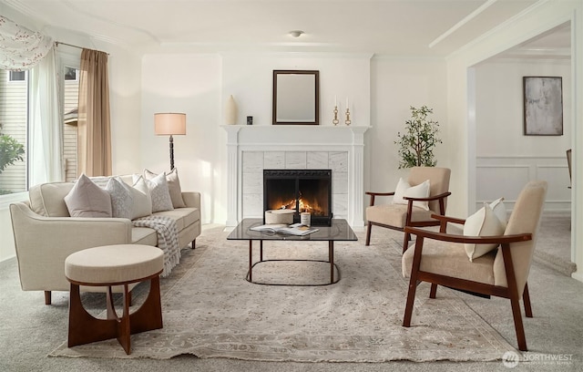 21629 NE 20th Way, Sammamish, WA 98074 - living room featuring crown molding, a fireplace, and carpet