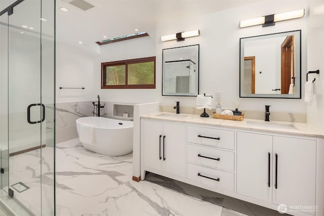 21629 NE 20th Way, Sammamish, WA 98074 - full bathroom with marble tiled floors, a marble finish shower, double vanity, a soaking tub, and recessed lighting