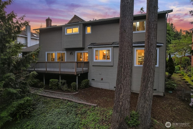 21629 NE 20th Way, Sammamish, WA 98074 - back of house at dusk with a wooden deck and a chimney
