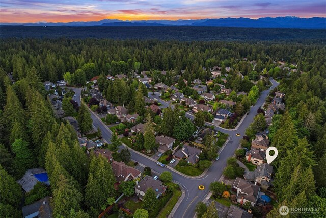 21629 NE 20th Way, Sammamish, WA 98074 - view of property location with a heavily wooded area, a mountainous background, and nearby suburban area