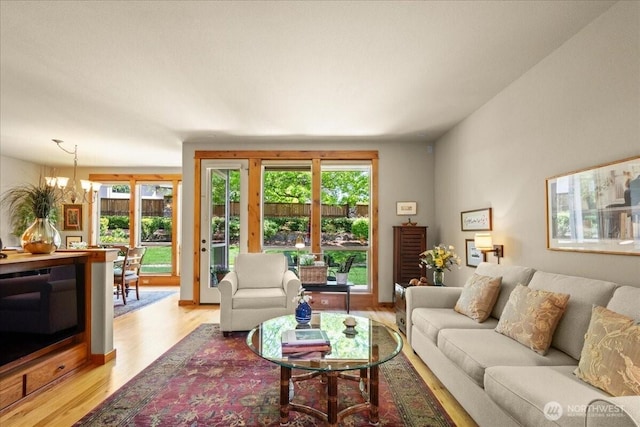 12800 NE Salmon Creek Ave Unit 118, Vancouver, WA 98686 - living room with light wood-style floors and a chandelier