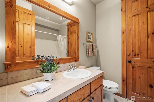 12800 NE Salmon Creek Ave Unit 118, Vancouver, WA 98686 - bathroom with toilet, tile patterned flooring, vanity, and a shower with shower curtain