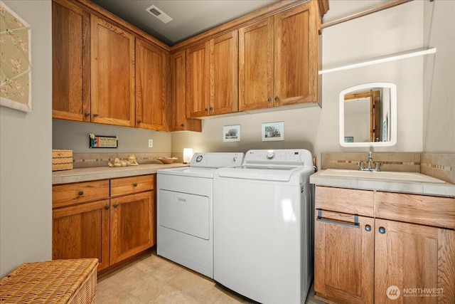 12800 NE Salmon Creek Ave Unit 118, Vancouver, WA 98686 - laundry area with cabinet space and washer and clothes dryer