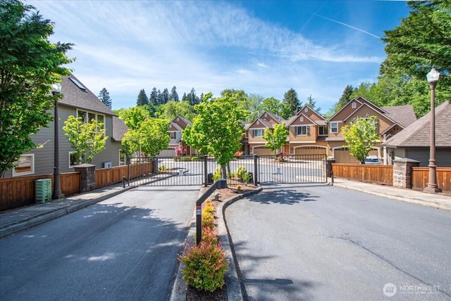 12800 NE Salmon Creek Ave Unit 118, Vancouver, WA 98686 - view of asphalt road with a gate, a residential view, and curbs