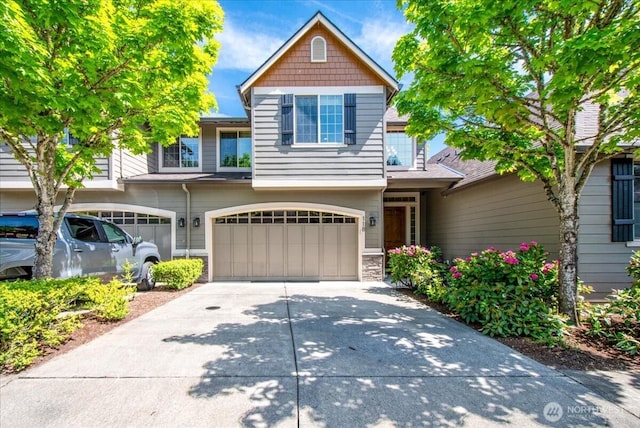 12800 NE Salmon Creek Ave Unit 118, Vancouver, WA 98686 - view of front of house with concrete driveway, a garage, and stone siding