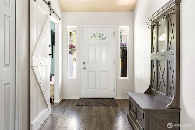 138 Bruinview Ln, Chehalis, WA 98532 - foyer featuring a barn door, dark wood finished floors, and baseboards