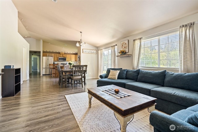 138 Bruinview Ln, Chehalis, WA 98532 - living area with vaulted ceiling, wood finished floors, and a chandelier