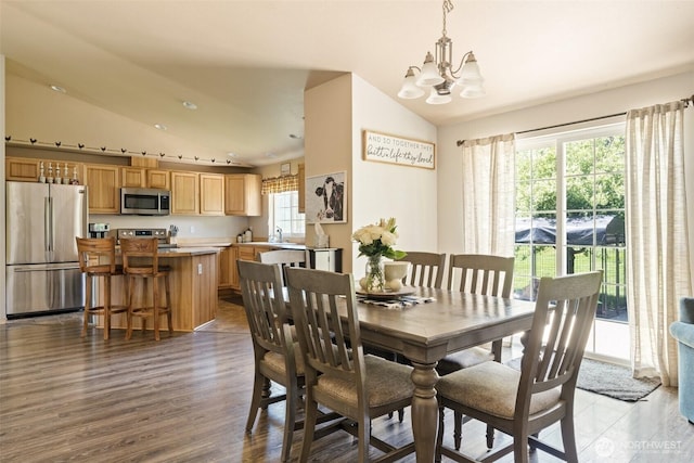138 Bruinview Ln, Chehalis, WA 98532 - dining area featuring vaulted ceiling, a chandelier, dark wood-style flooring, and recessed lighting