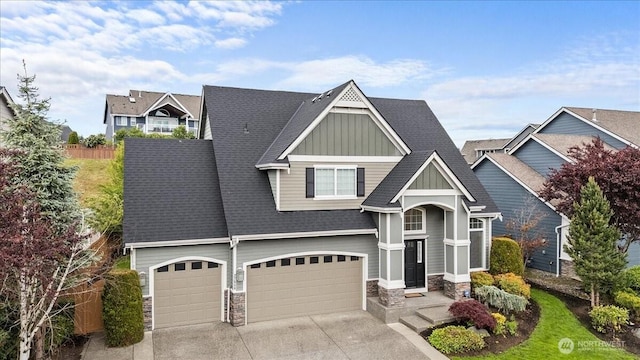 27546 254th Way SE, Maple Valley, WA 98038 - craftsman-style home featuring board and batten siding, stone siding, driveway, an attached garage, and roof with shingles