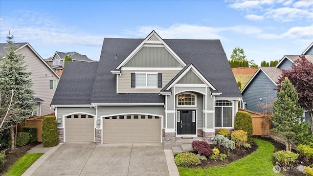 27546 254th Way SE, Maple Valley, WA 98038 - craftsman-style home featuring stone siding, board and batten siding, concrete driveway, a shingled roof, and an attached garage