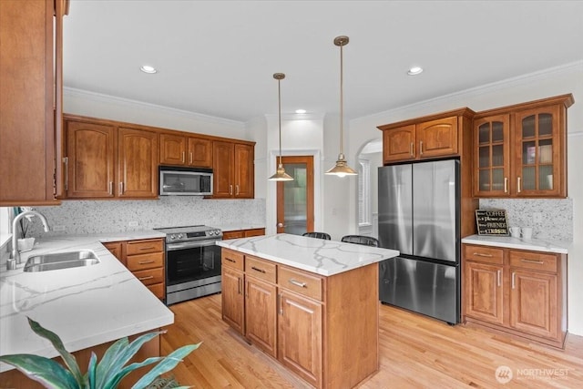27546 254th Way SE, Maple Valley, WA 98038 - kitchen with stainless steel appliances, a sink, light stone countertops, tasteful backsplash, and a center island