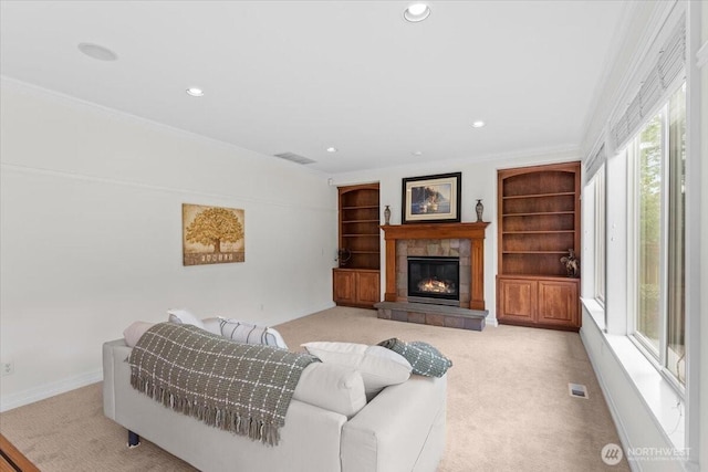 27546 254th Way SE, Maple Valley, WA 98038 - carpeted living area with a tiled fireplace, recessed lighting, crown molding, and baseboards