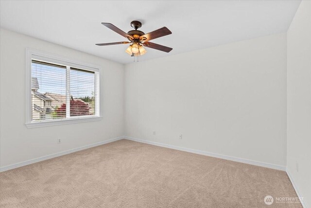 27546 254th Way SE, Maple Valley, WA 98038 - spare room with light carpet and baseboards