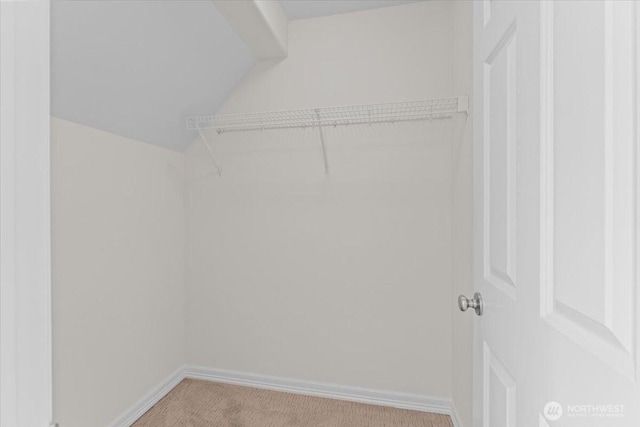 27546 254th Way SE, Maple Valley, WA 98038 - spacious closet featuring light colored carpet and vaulted ceiling