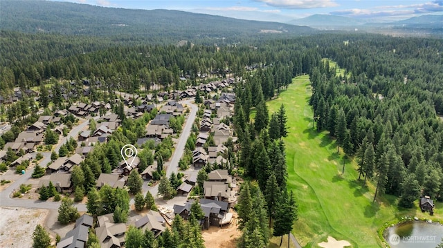 221 Cake Box Ln, Cle Elum, WA 98922 - aerial view of residential area featuring a heavily wooded area and a mountain backdrop