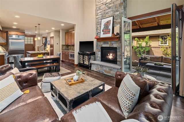 221 Cake Box Ln, Cle Elum, WA 98922 - living area with stairs, dark wood finished floors, a fireplace, and recessed lighting
