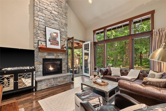 221 Cake Box Ln, Cle Elum, WA 98922 - living room featuring high vaulted ceiling, a fireplace, and hardwood / wood-style floors