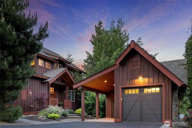 221 Cake Box Ln, Cle Elum, WA 98922 - view of front of property featuring a shingled roof, board and batten siding, and asphalt driveway