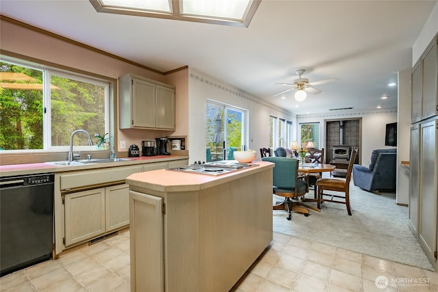 1117 W Racine St, Bellingham, WA 98229 - kitchen featuring dishwasher, a sink, stainless steel stovetop, light countertops, and open floor plan