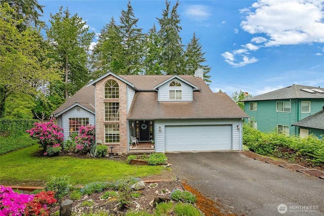 1117 W Racine St, Bellingham, WA 98229 - traditional-style home featuring driveway, a front lawn, roof with shingles, and a garage