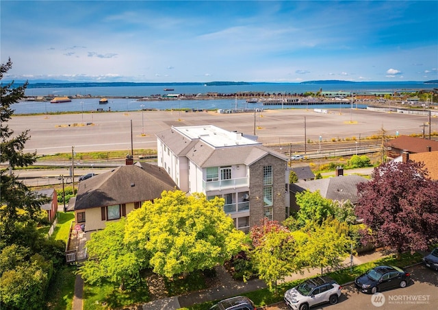 view of subject property with a nearby body of water