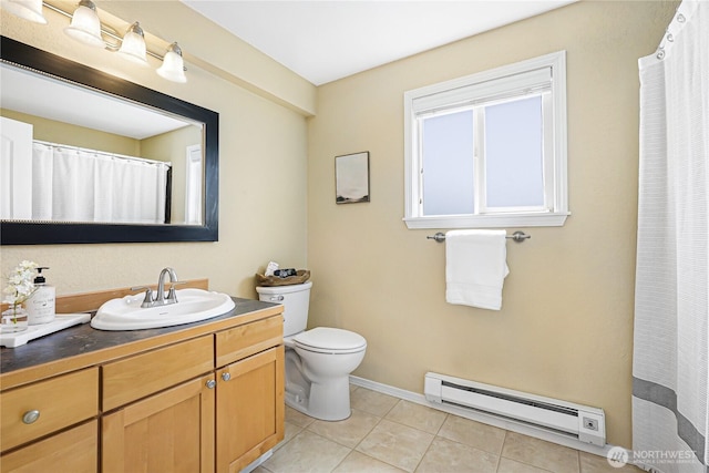 bathroom featuring a baseboard radiator, baseboards, tile patterned floors, vanity, and toilet