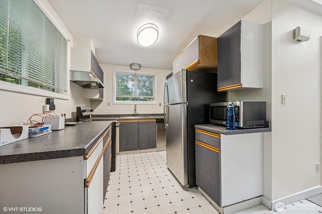 22434 SE Auburn-Black Diamond Rd, Black Diamond, WA 98010 - kitchen featuring stainless steel appliances, dark countertops, and wall chimney exhaust hood