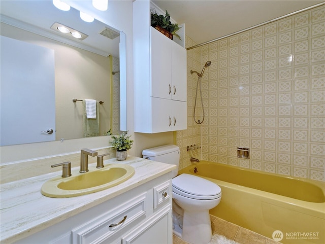 full bathroom featuring toilet, vanity, bathing tub / shower combination, and tile patterned flooring