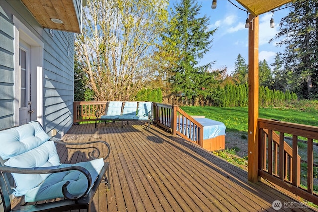 deck featuring a lawn